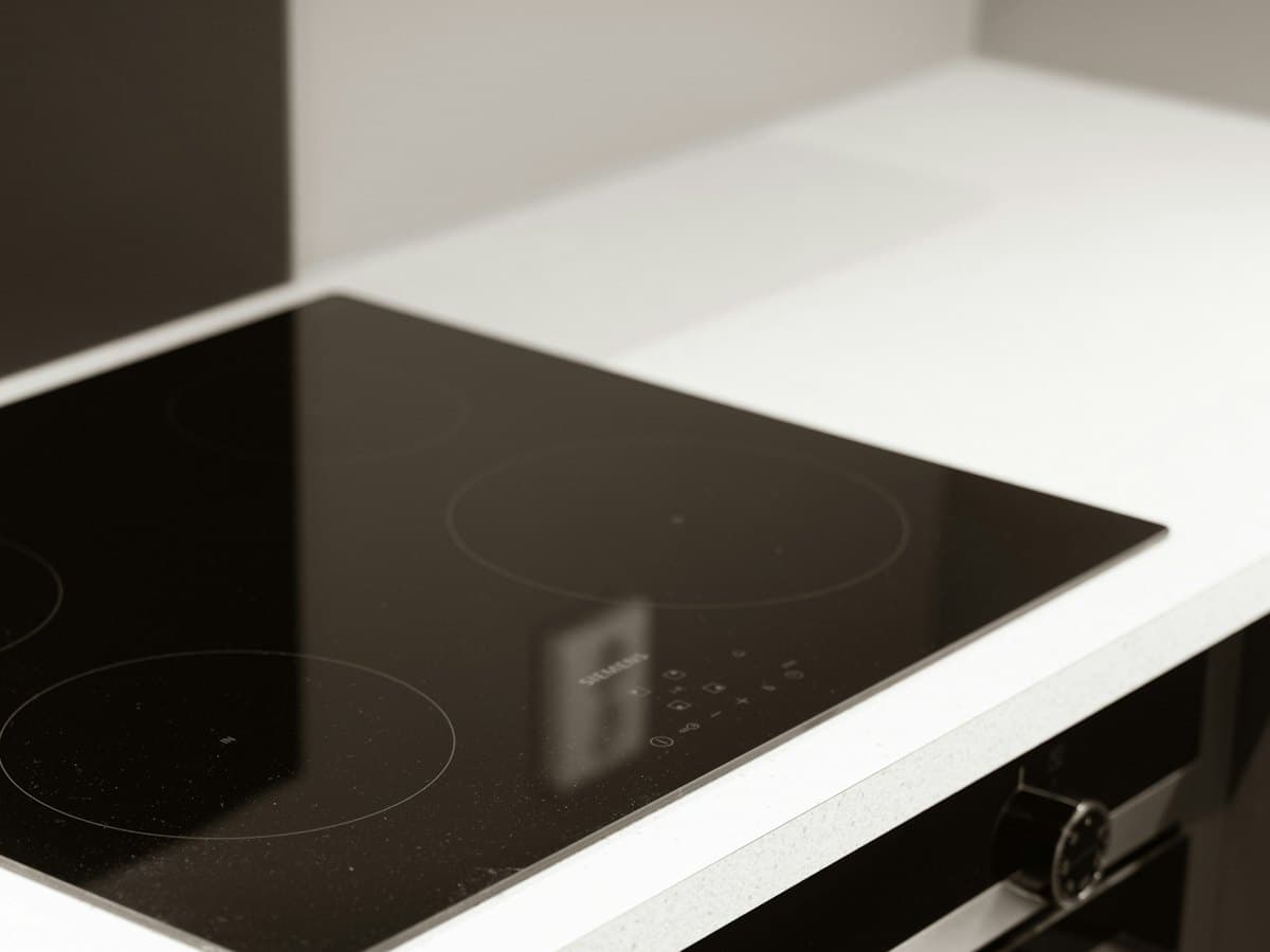 A black glass induction cooktop